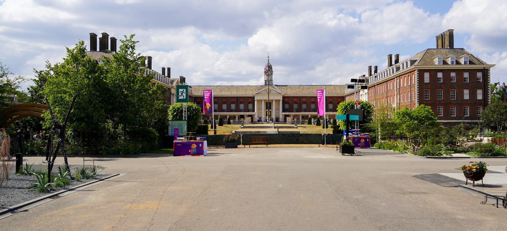 The Royal Hospital Chelsea is the backdrop to a photo of Chelsea Flower Show 2025, with shrubs, trees and banners in the foreground