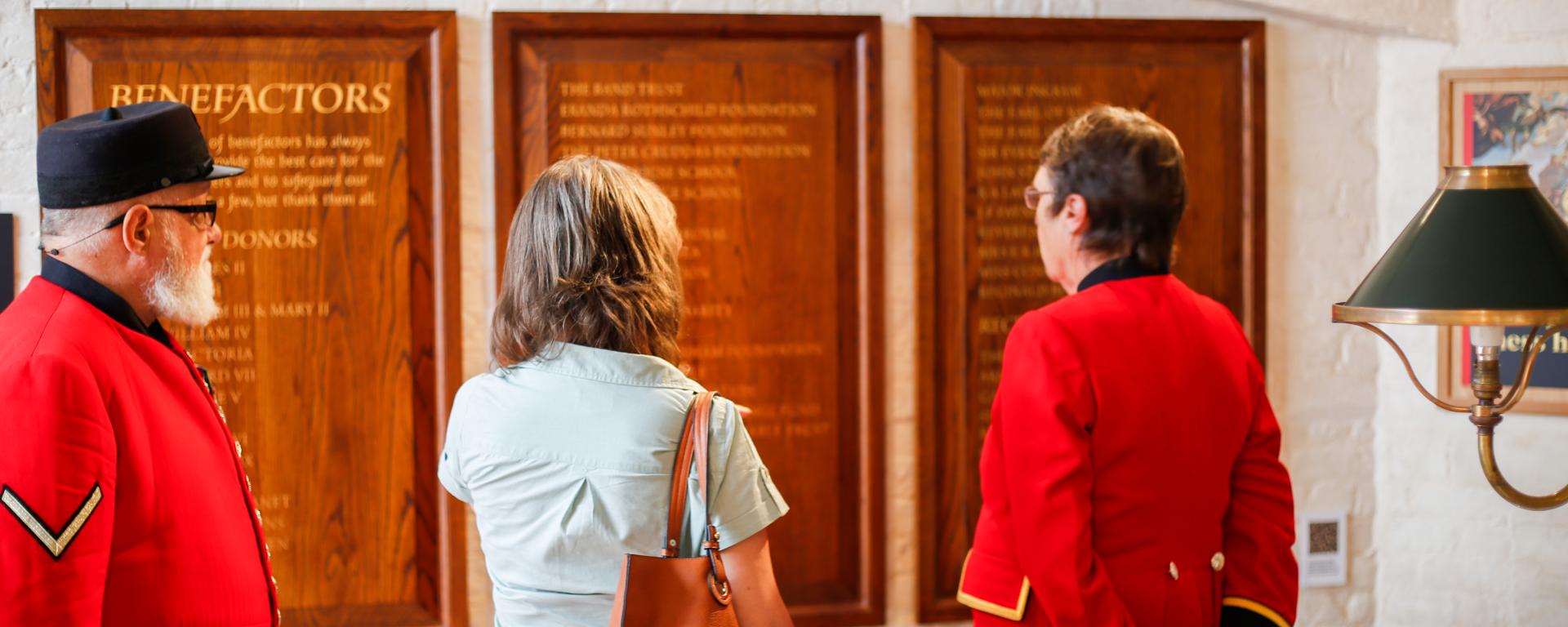 Chelsea Pensioners stand alongside a visitor in the newly opened museum