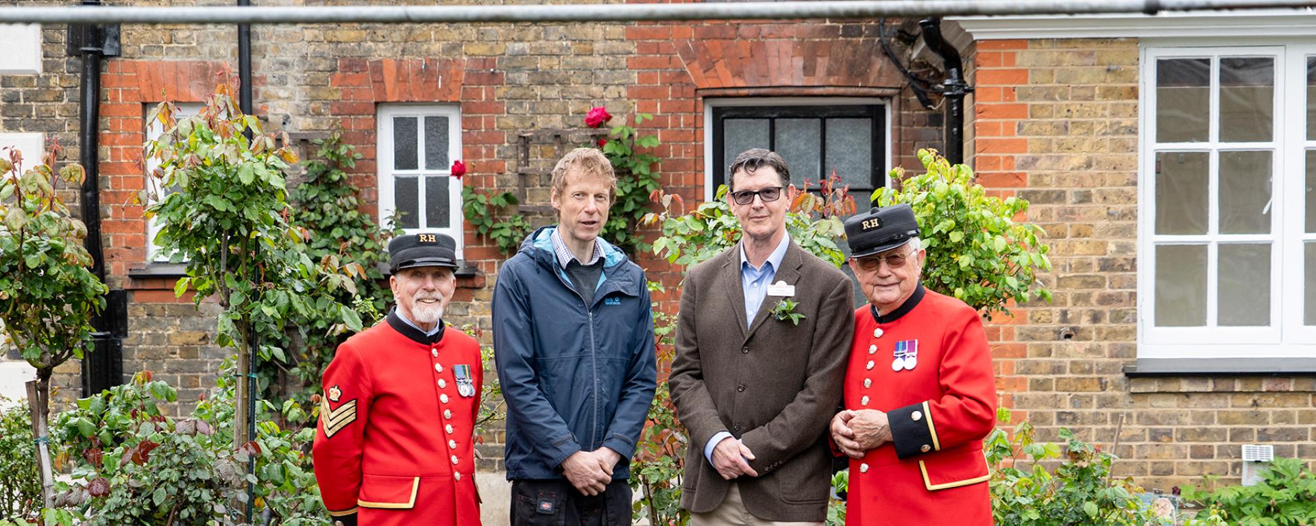 Chelsea Pensioners stand alongside Royal Hospital's groundsman and the designer of the Chelsea Pensioner Garden
